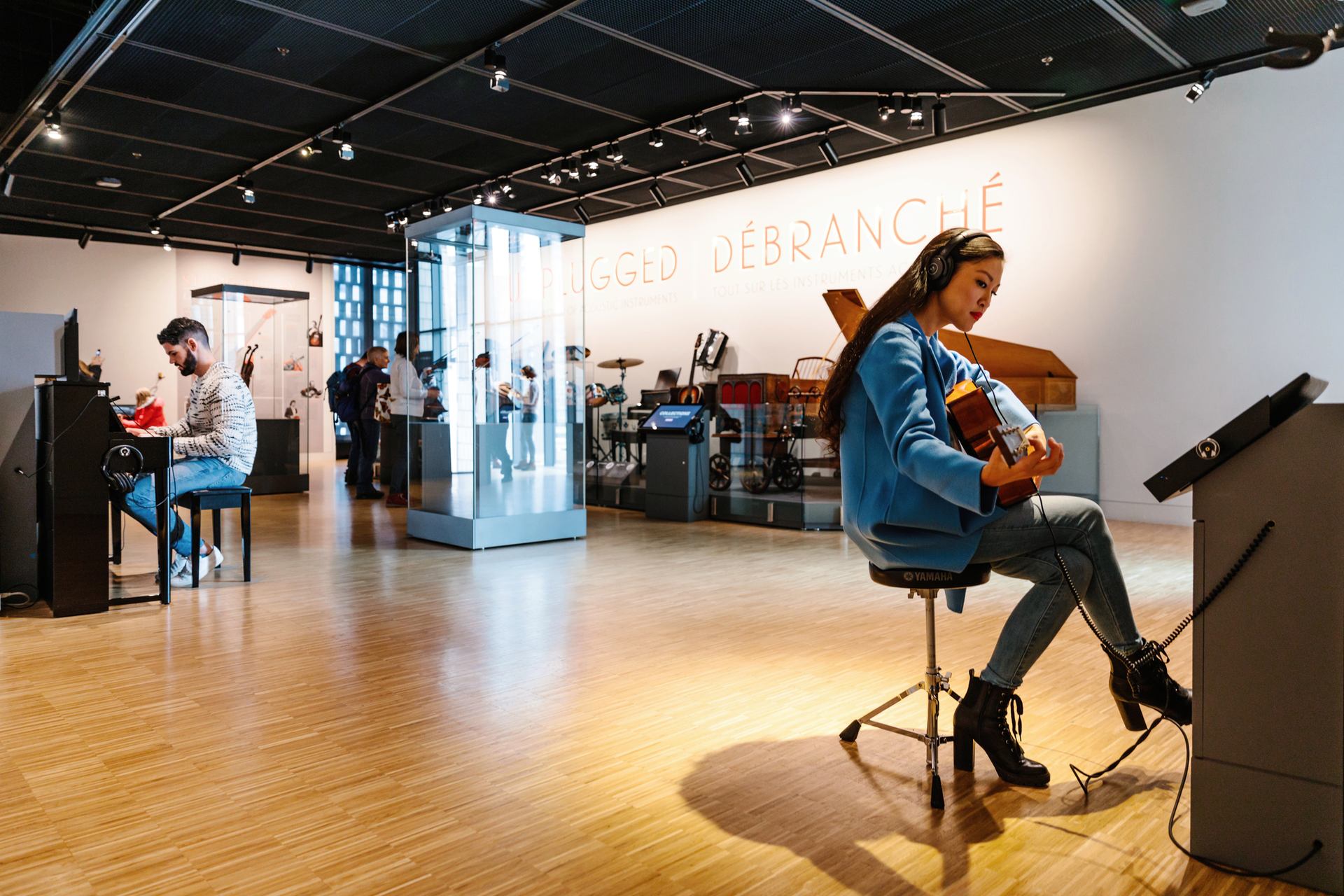 People play instruments inside the Studio Bell museum.