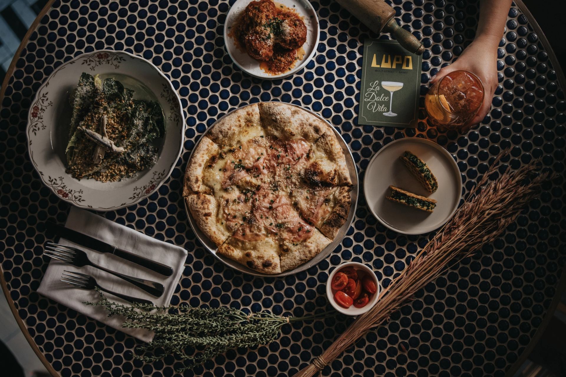 An overhead shot of various dishes at Lupo in Banff, Alberta.