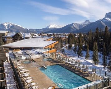 Exterior shot overlooking the Malcom Hotel in Canmore with a great mountain vista.