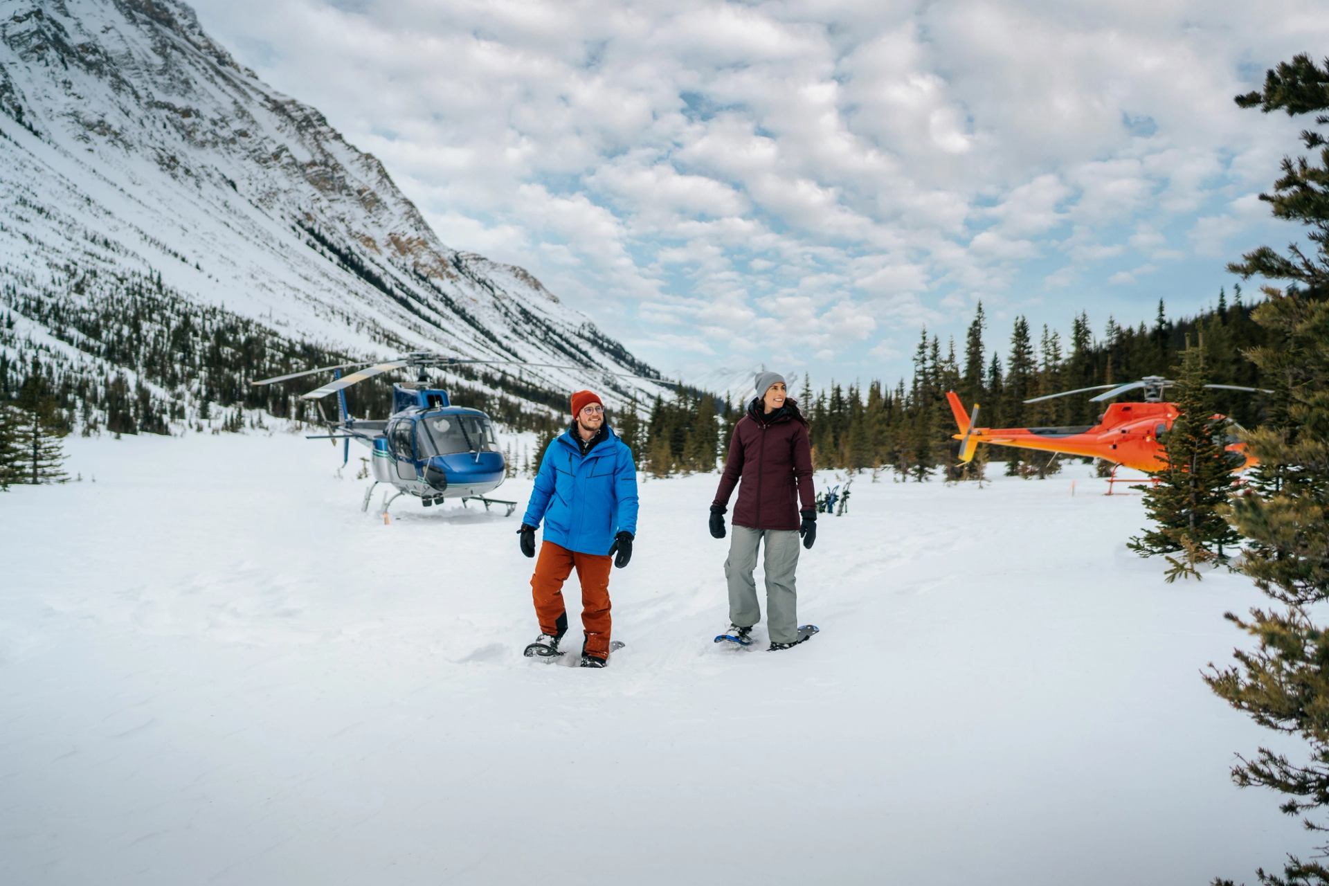 Couple going Heli snowshoeing Nordegg Rockies Heli