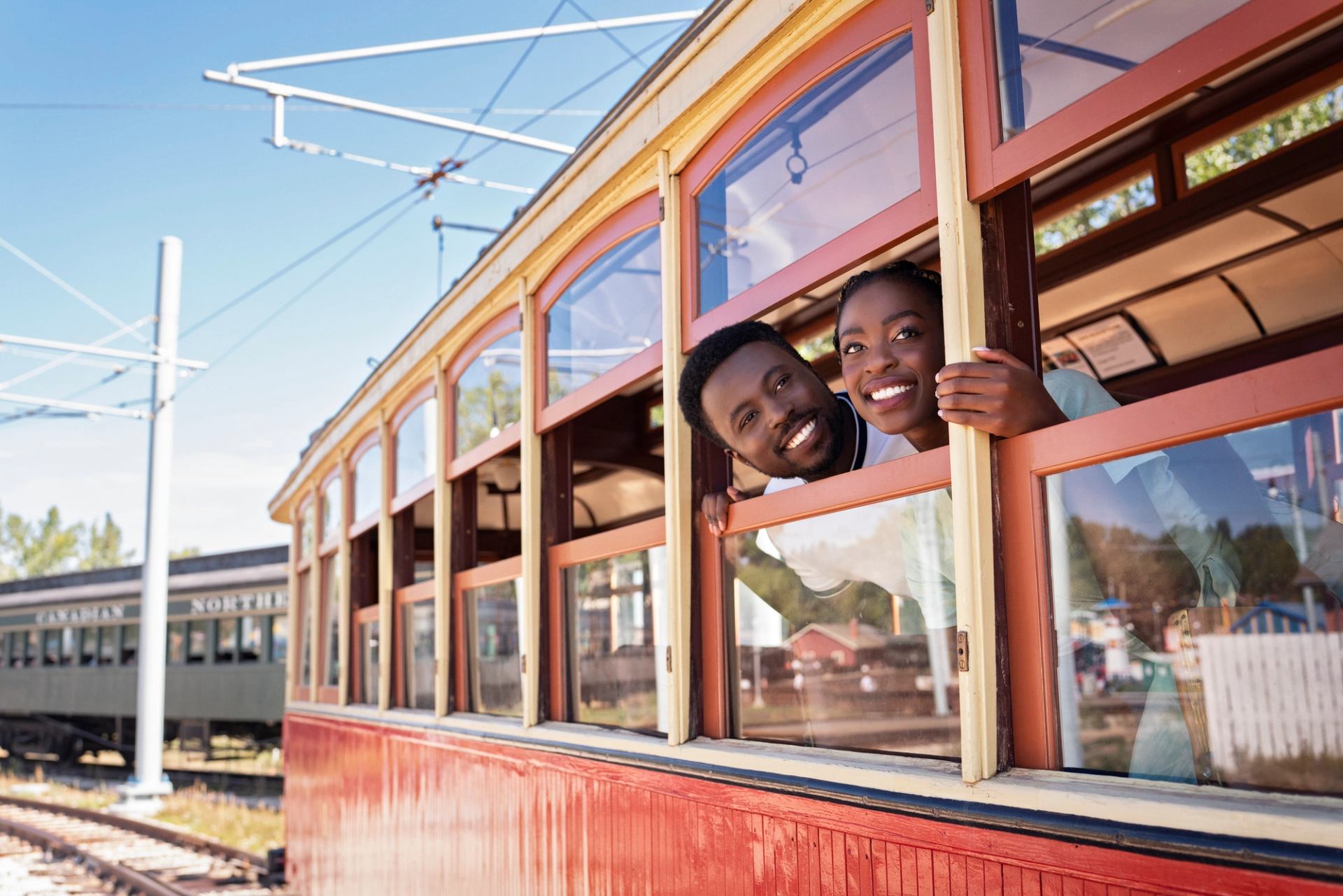 Couple looking out of the streetcar at Fort Edmonton Park