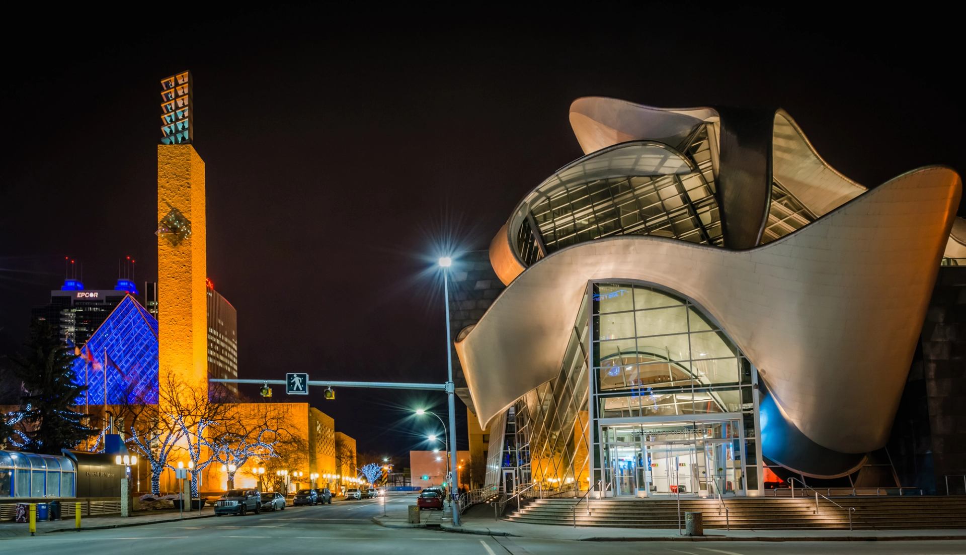 The Art Gallery of Alberta and downtown city lights at night in Edmonton.