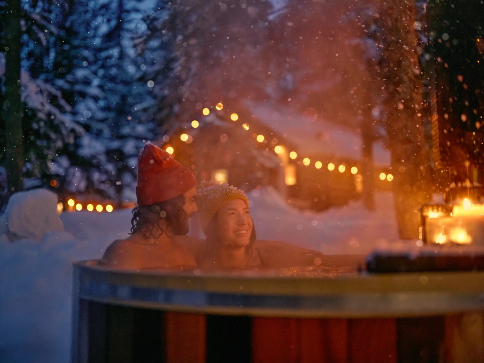 A couple enjoying a relaxing winter stay at Storm Mountain Lodge in Banff National Park.