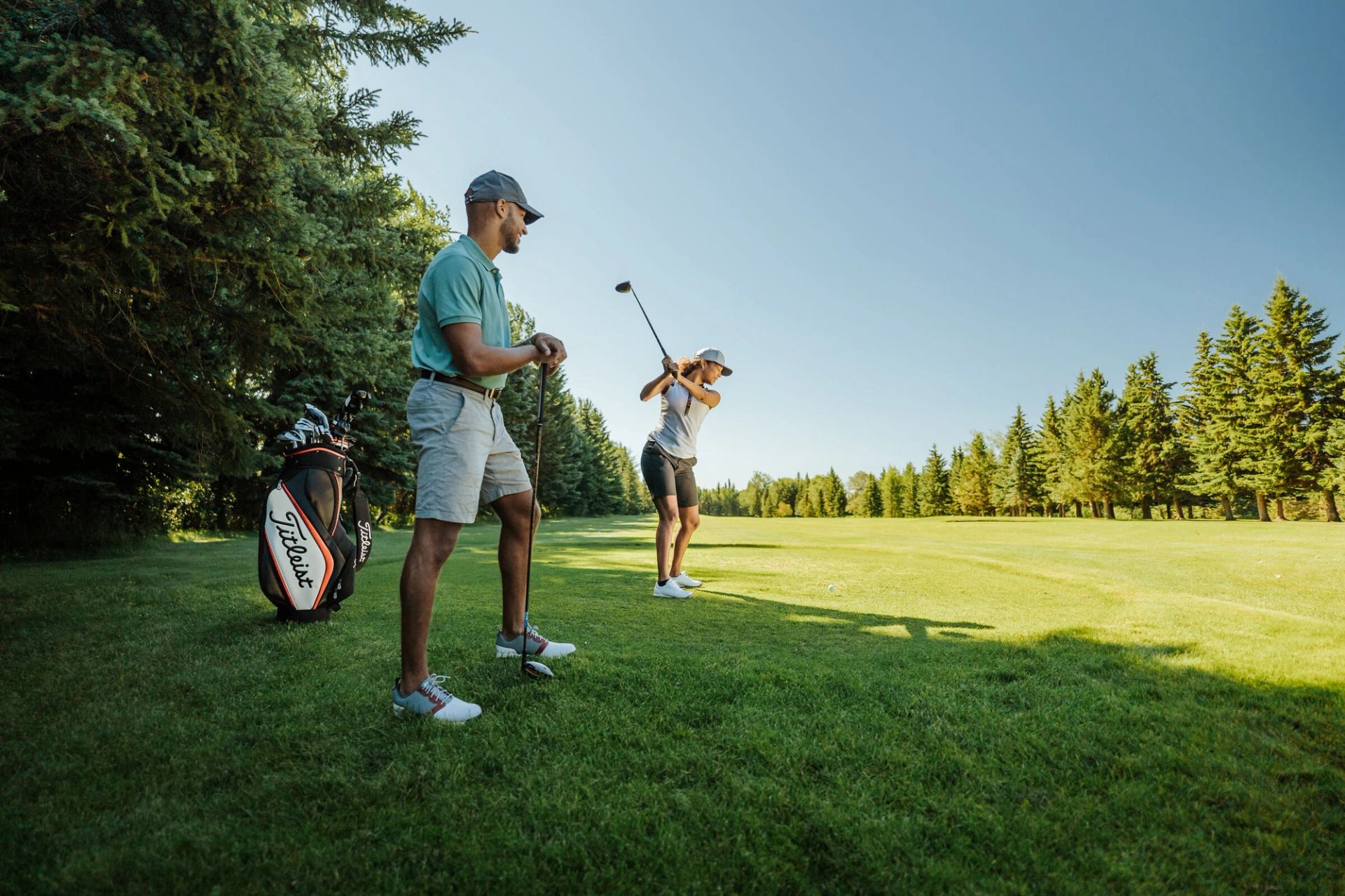 A couple golfing at Grande Prairie Golf and Country Club.