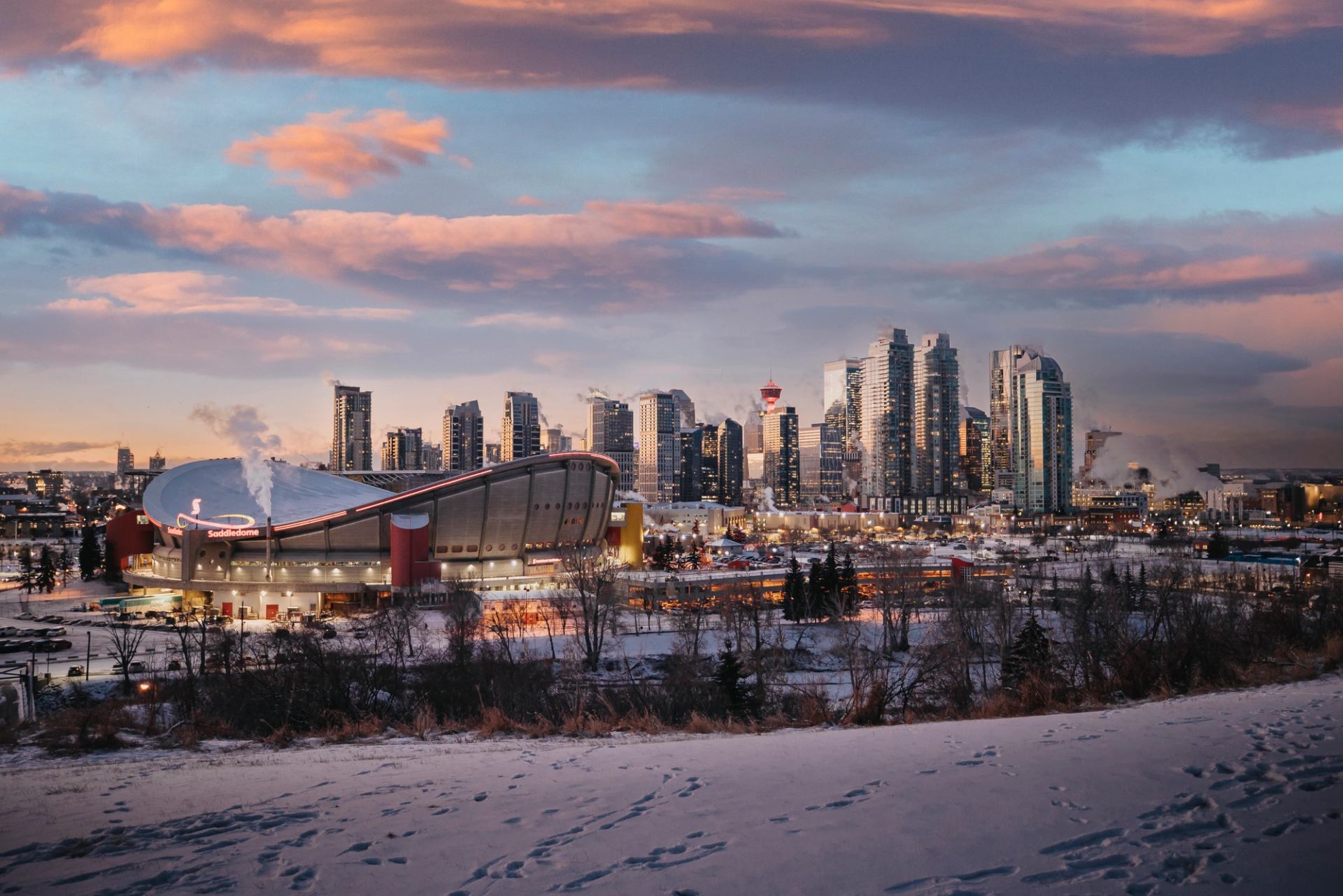 Calgary City Centre with Scoitiabank Saddledome as seen from Scotsman's Hill, nearing sunset