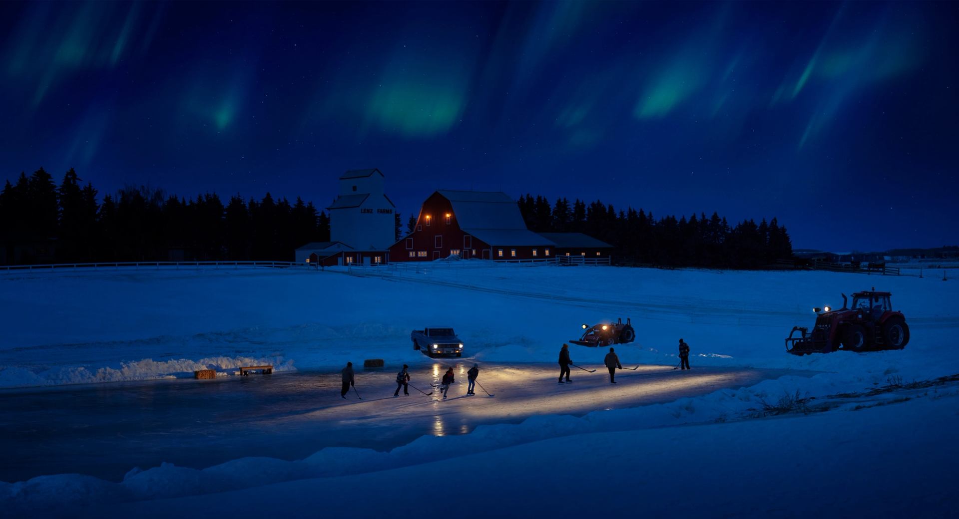 Team playing a game of night time pond hockey on a rural Albertan farm.