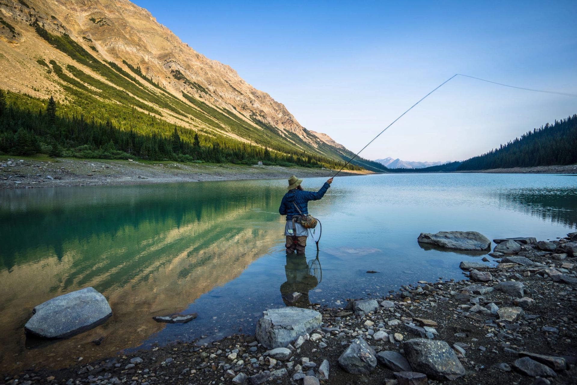 Scenic shot of man fly fishing at Landslide Lake.
