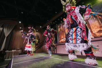 Indigenous dancers on stage at Stoney Nakoda Resort.