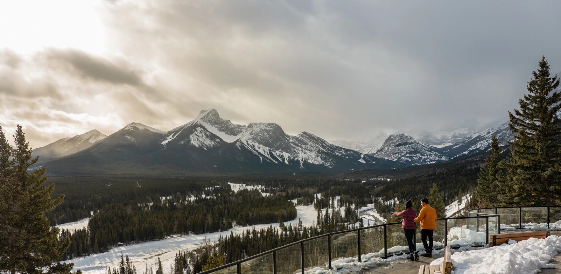 Couple enjoying the viewpoints along the trails at the Pomeroy Kananaskis Mountain Lodge.