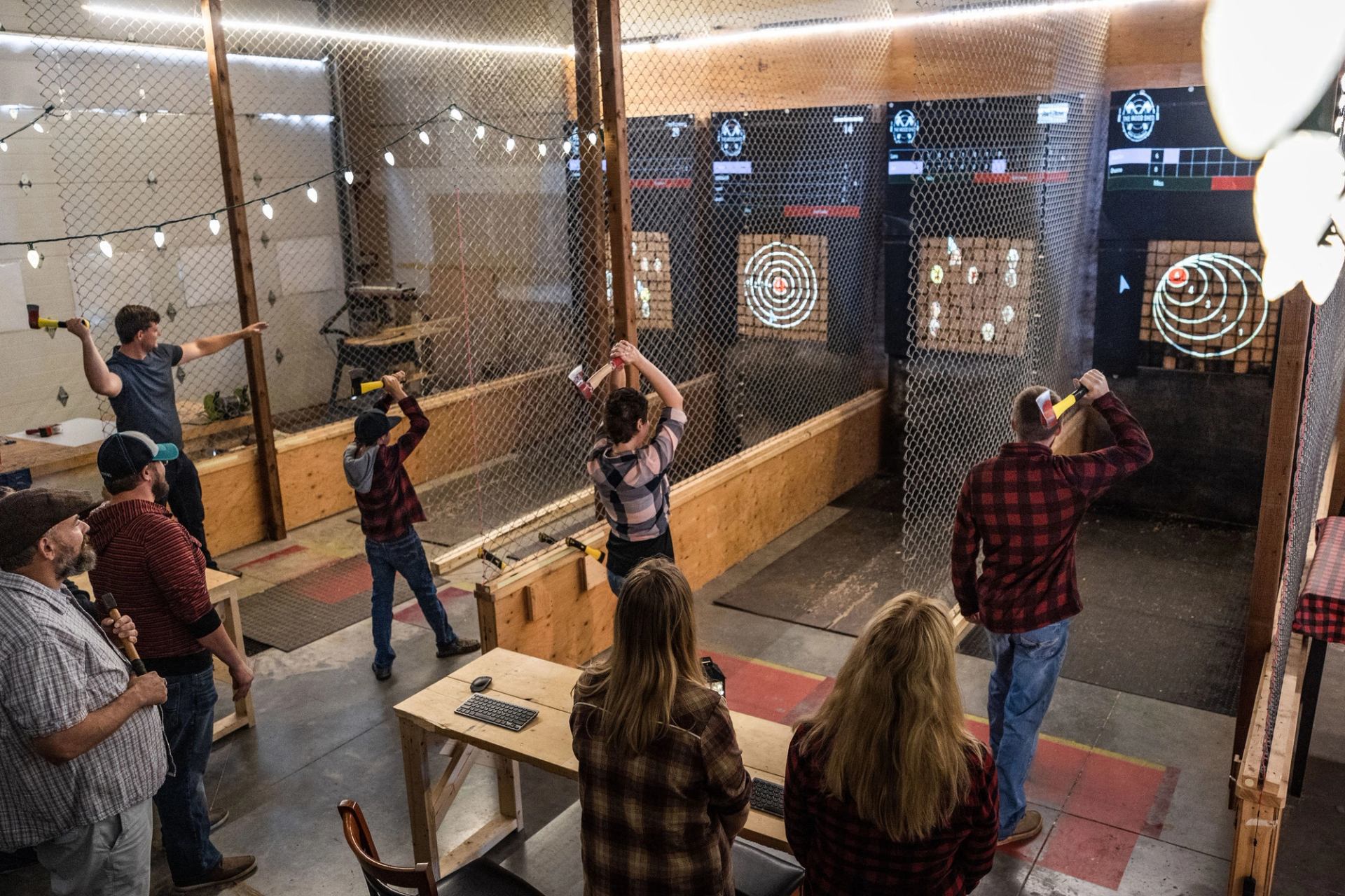 People axe throwing at the Wood Shed in Sylvan Lake.