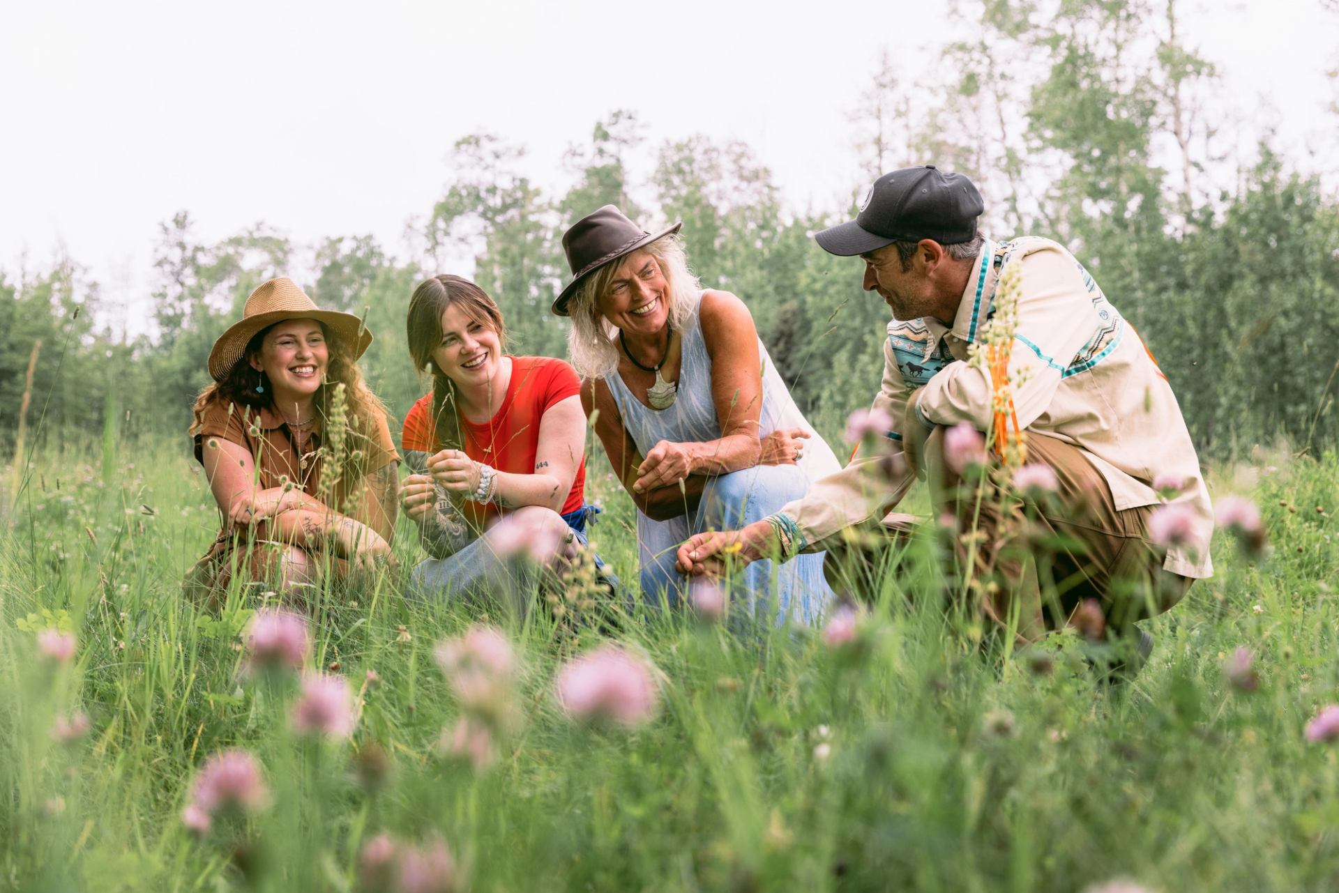 People viewing flowers with an Indigenous guide