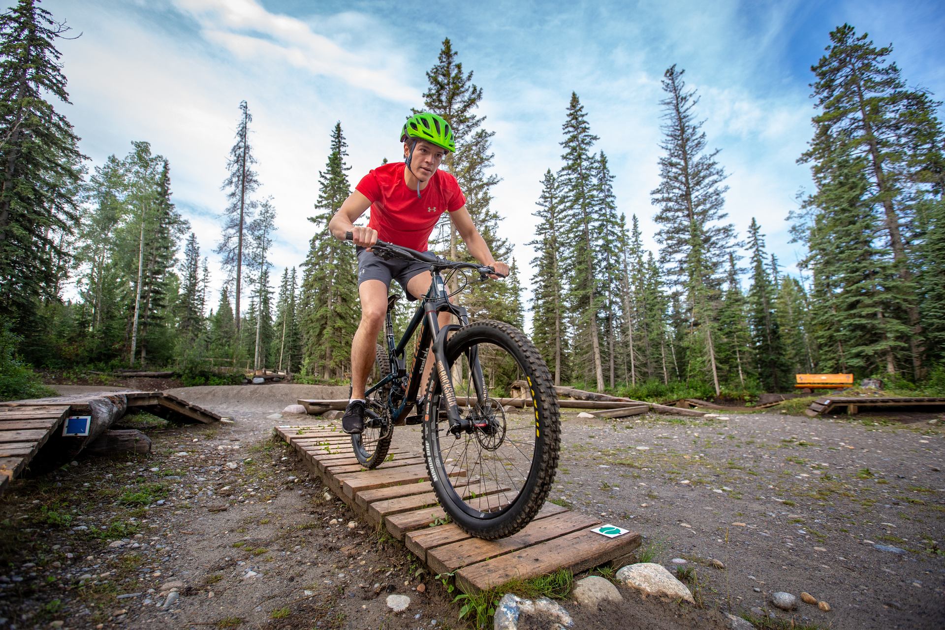 A boy rides a bike along a track at the Hinton Bike Park.