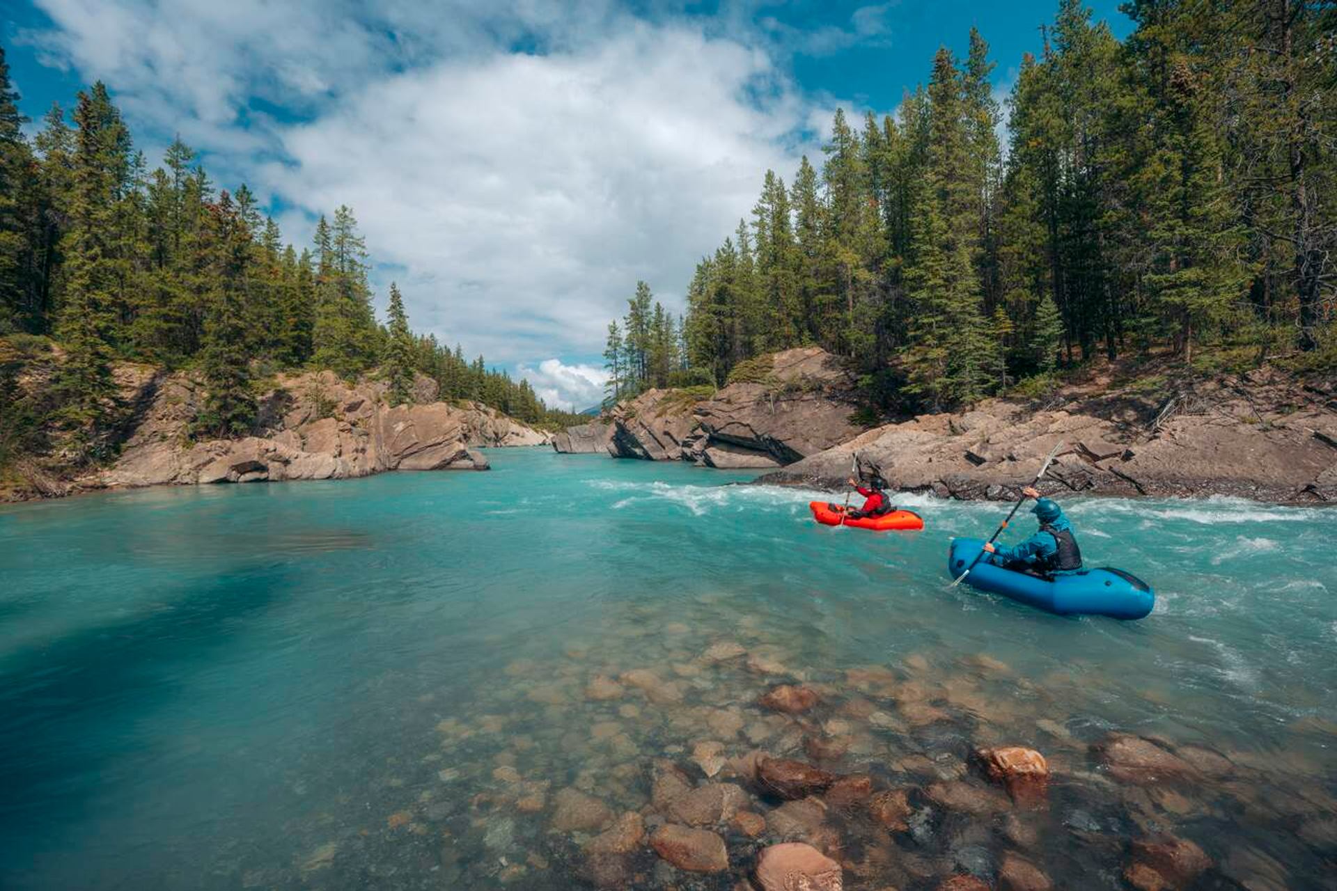 2 Pack Rafters paddle down the Cline River