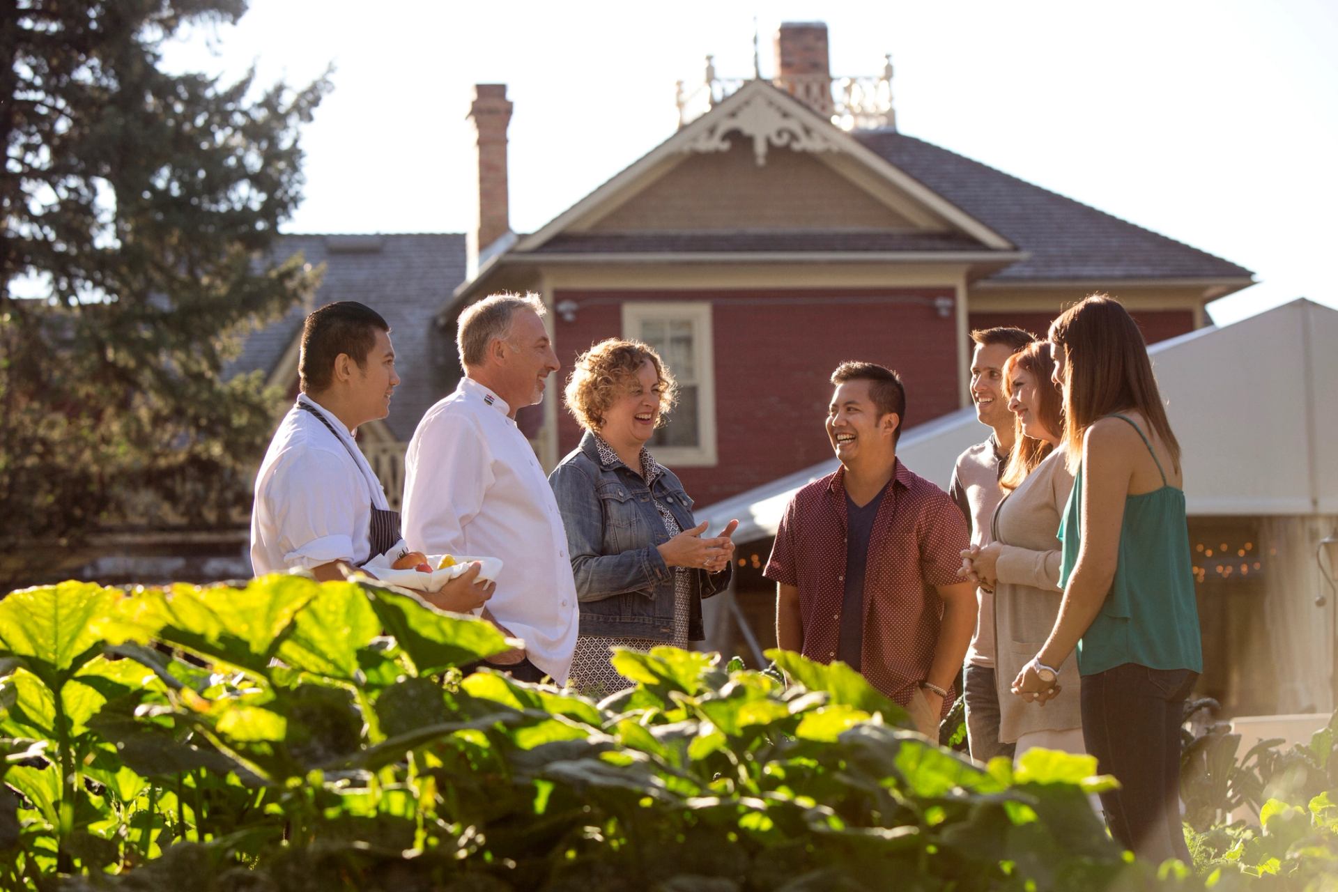 Group of people learning about Rouge restaurant’s farm to fork process