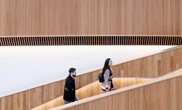 Couple walking up staircase at the Central Library.
