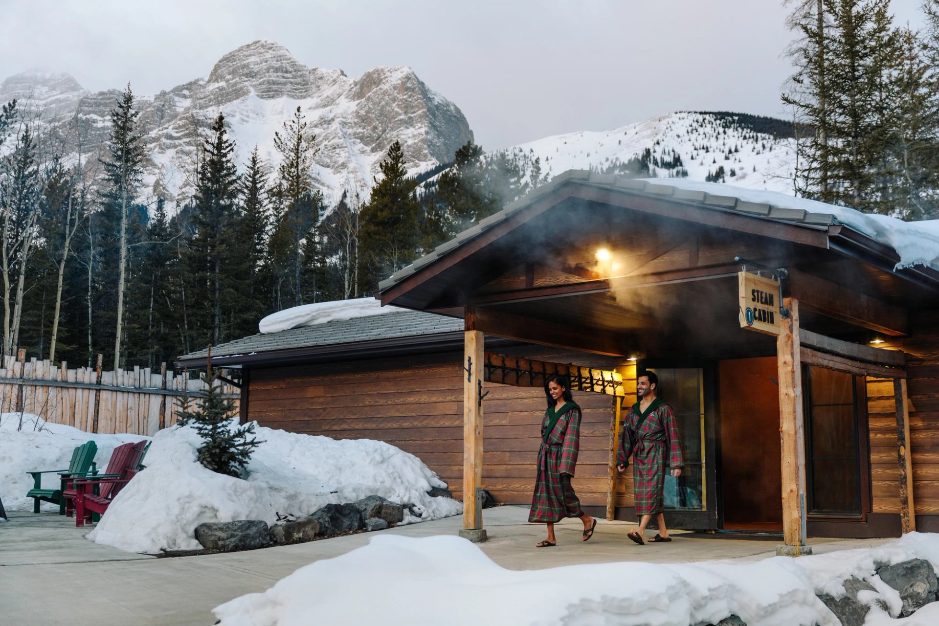 Couple enjoying the Nordic Spa in winter in Kananaskis Country.