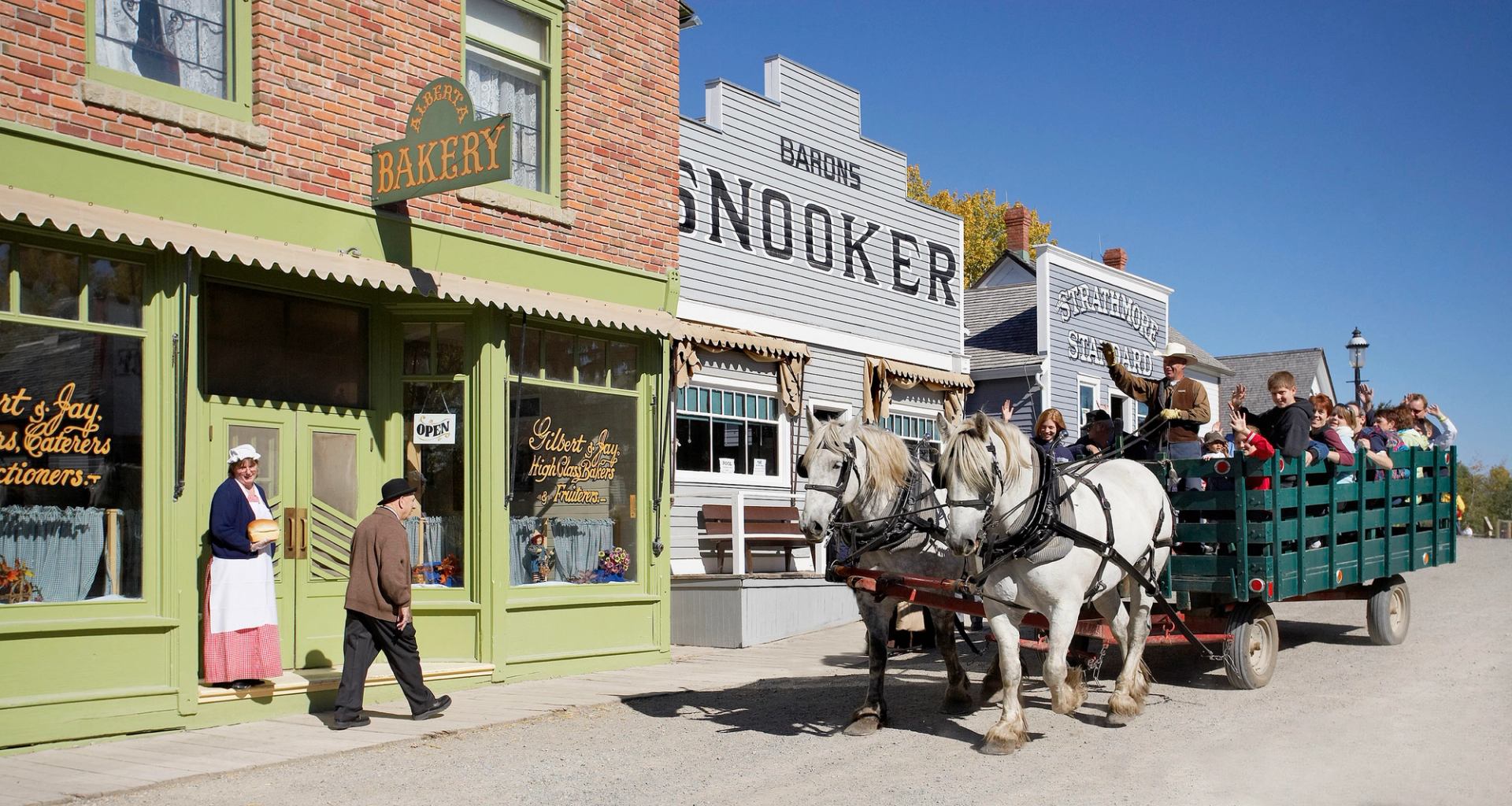 Visitors enjoying a wagon ride at Heritage Park