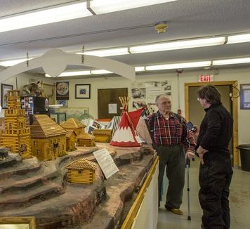 Two men looking at exhibits in a Museum.