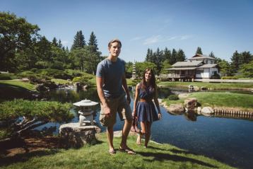 A couple walking through the Nikka Yuko Japanese Gardens in Lethbridge.