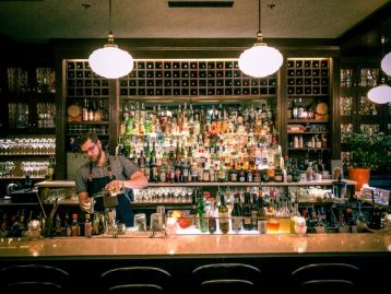 Bartender making a drink at Bar Clementine in Edmonton