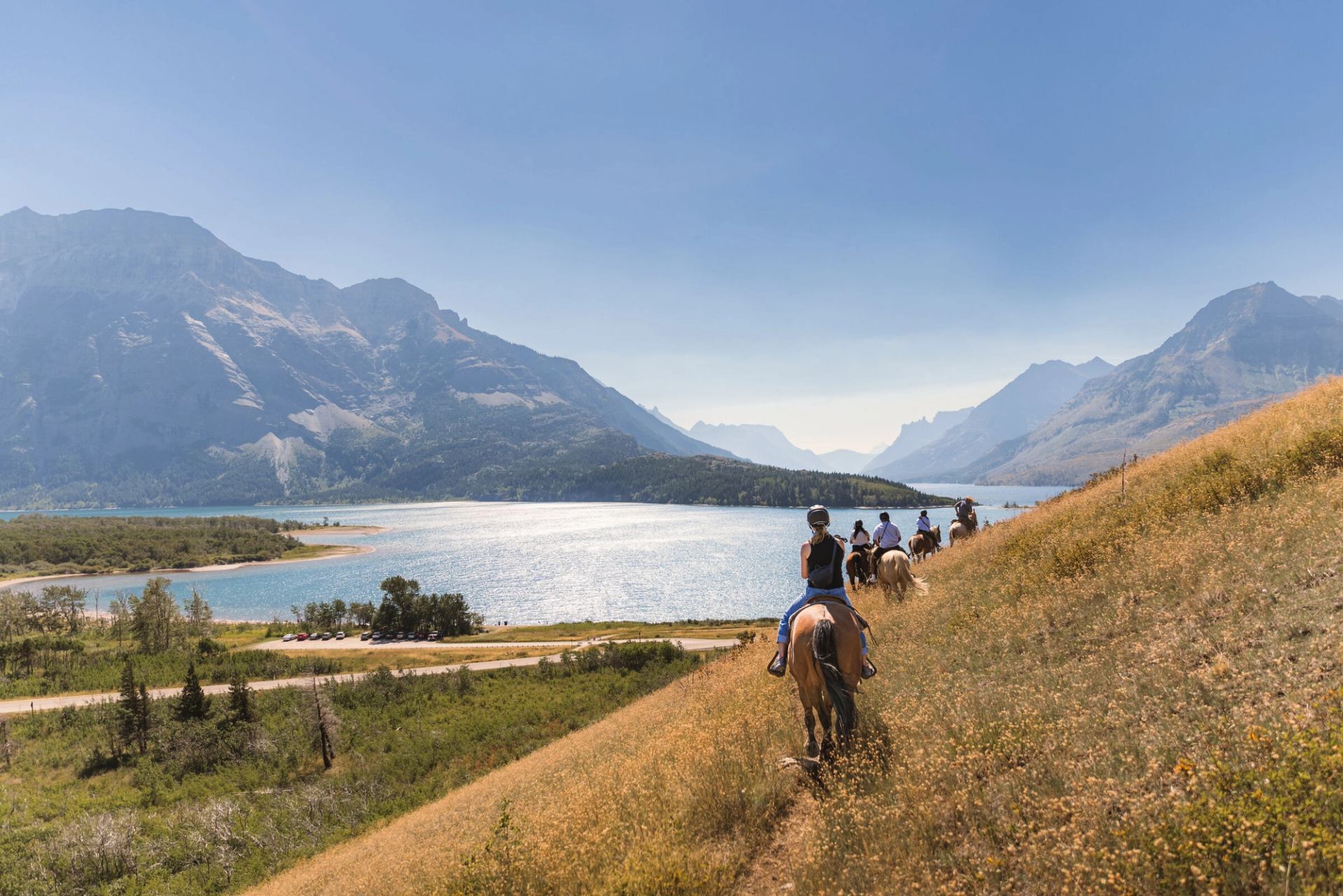 A group on horseback explore Waterton Lakes National Park.