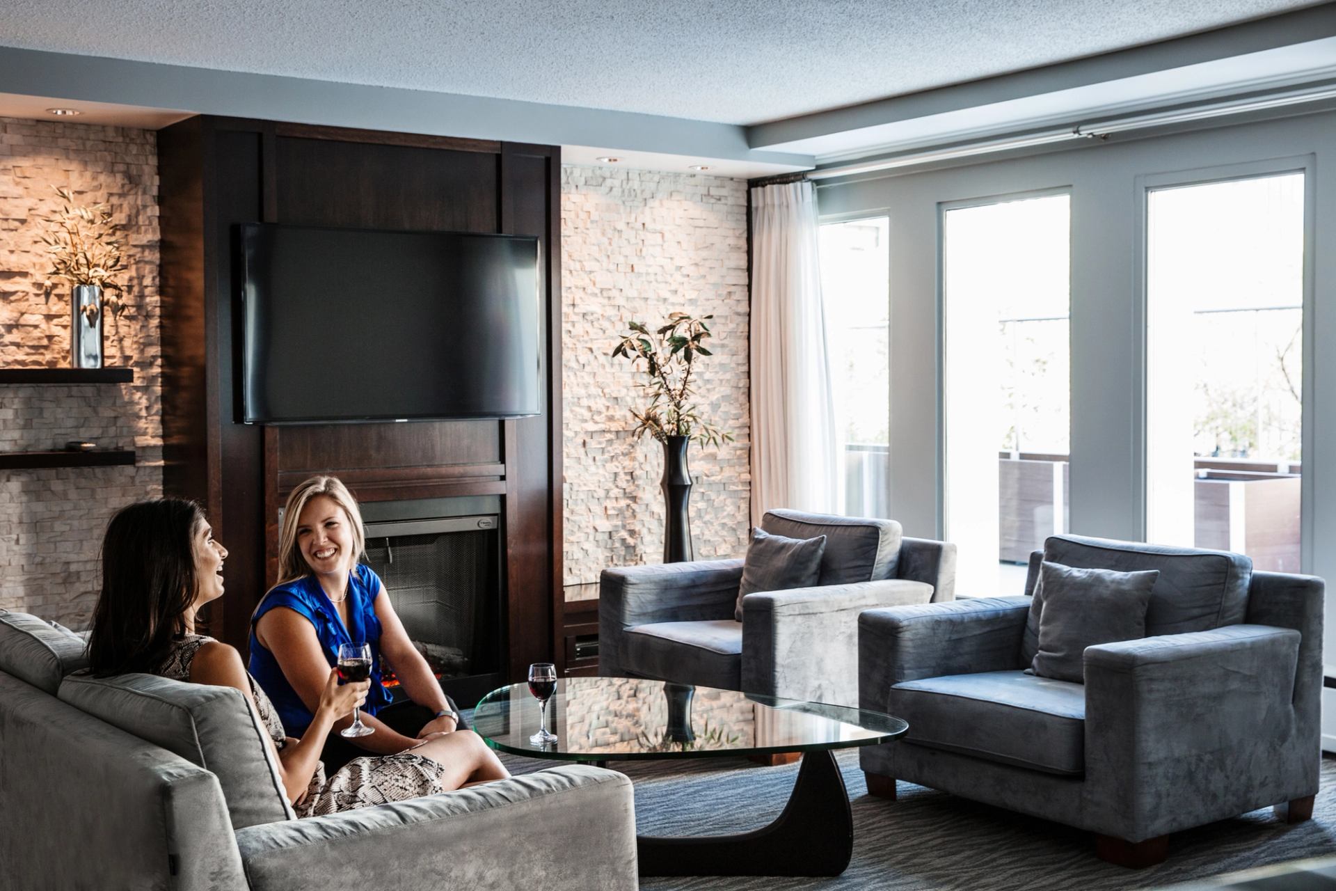 Women having a glass of wine in the lounge at the Matrix Hotel in Edmonton.