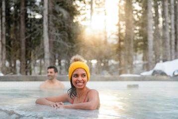 Couple in outdoor pool at kananaskis nordic spa