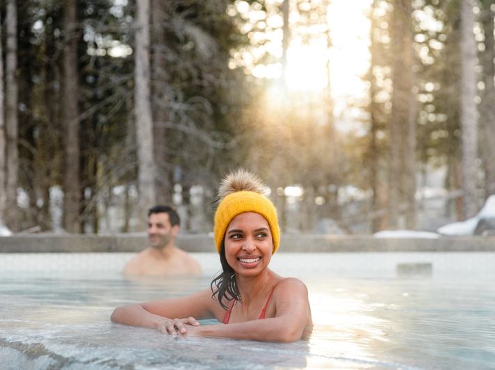 Couple in outdoor pool at kananaskis nordic spa