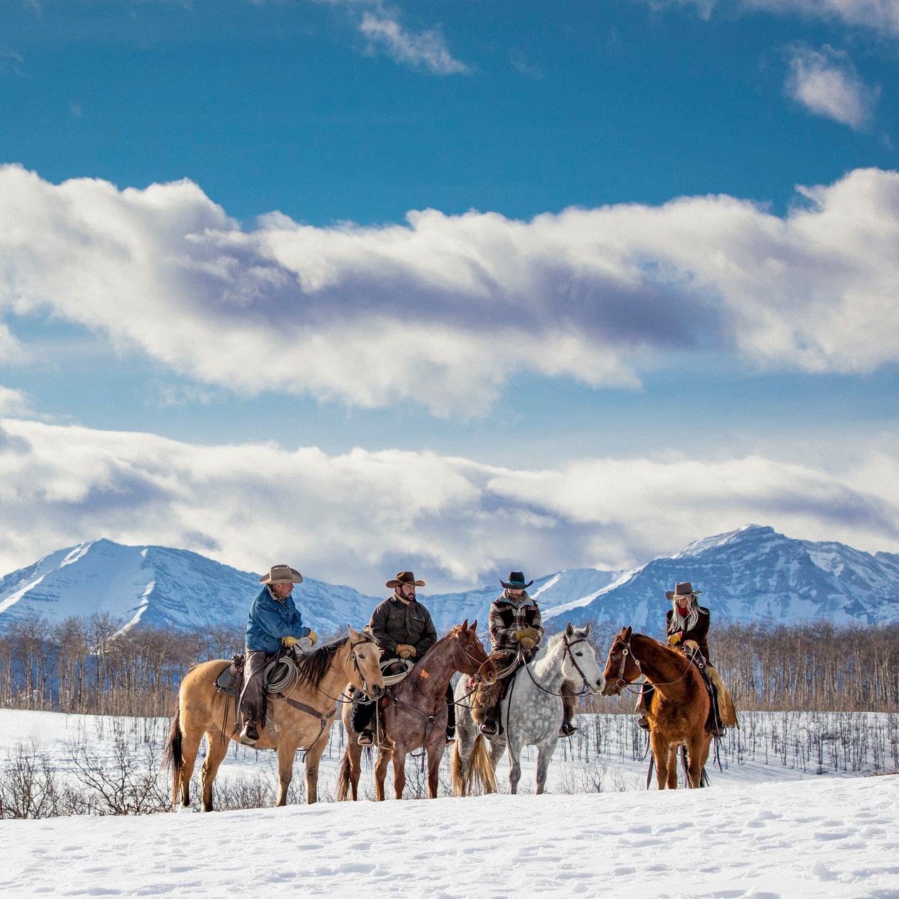 People horseback riding in winter