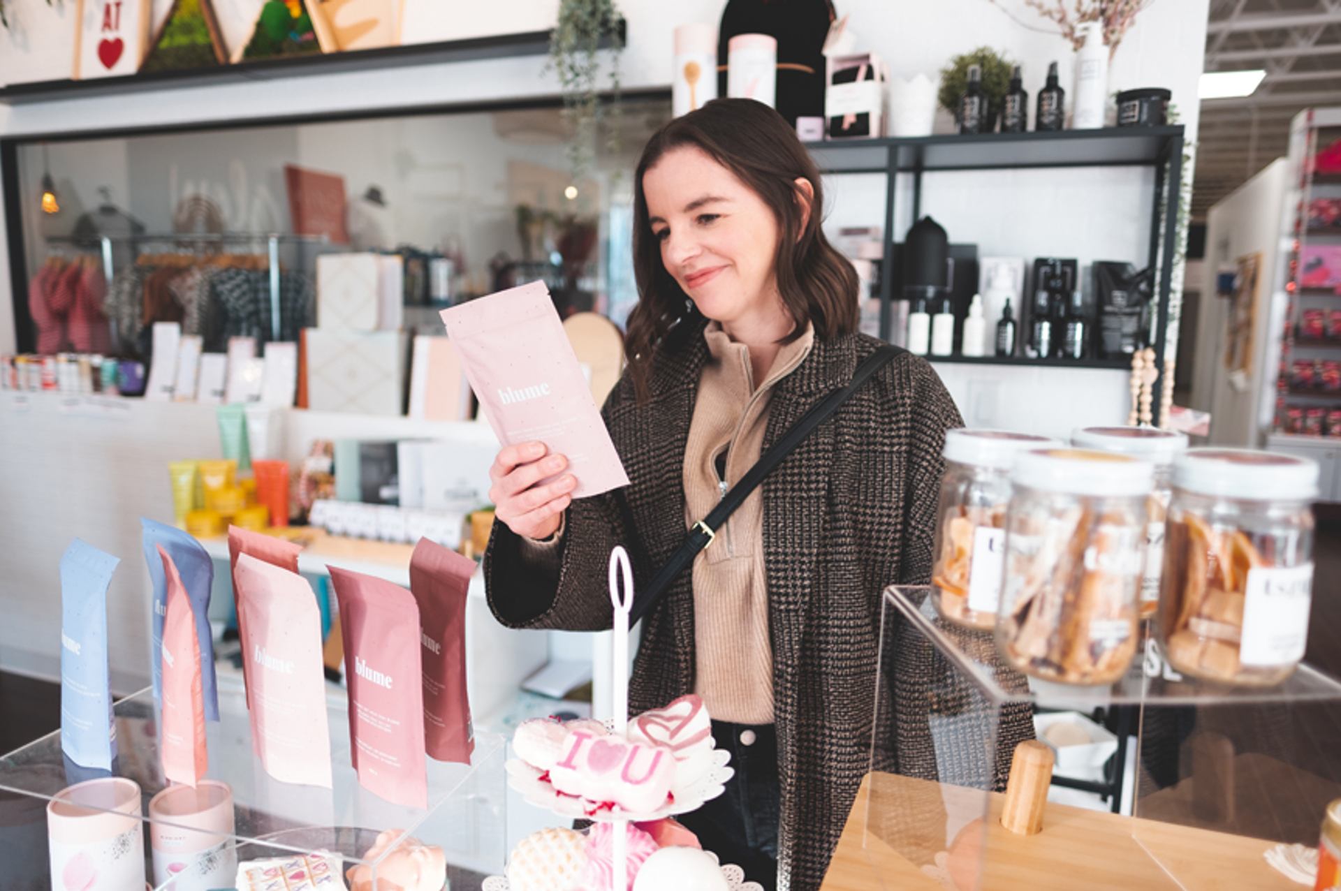 Woman shopping and looking at products in a store.