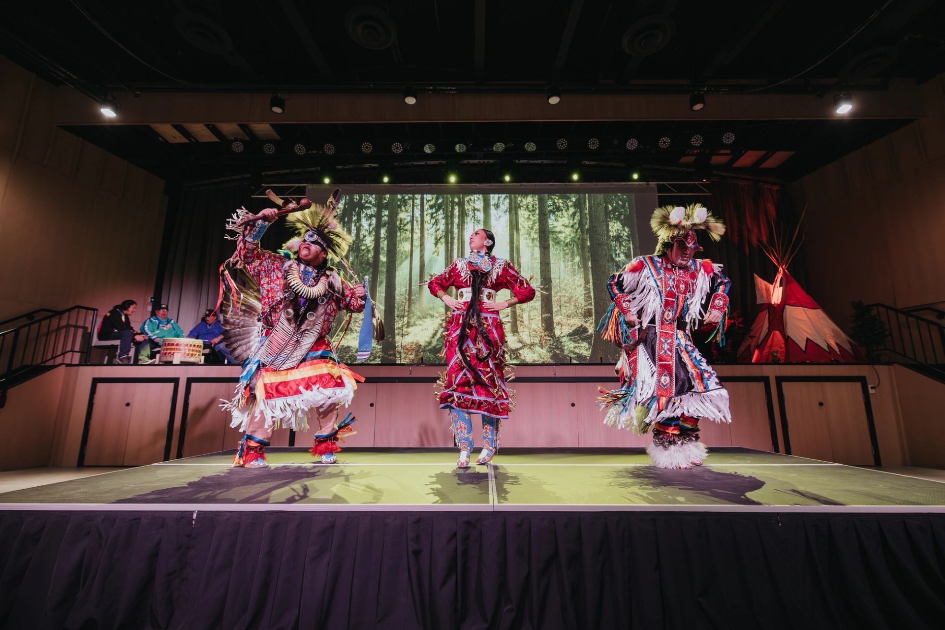 Indigenous dancers on stage at Stoney Nakoda Resort.