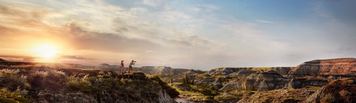 People taking photos at Horseshoe Canyon in the Canadian Badlands.