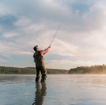 Man fly fishing in the Athabasca River