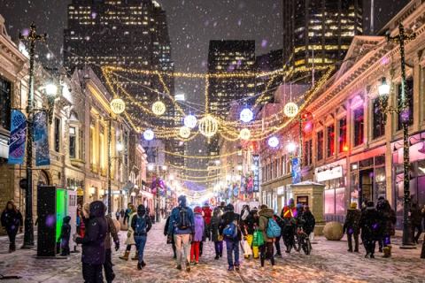 Festivalgoers walk down a wintery street during Chinook Blast in downtown Calgary.