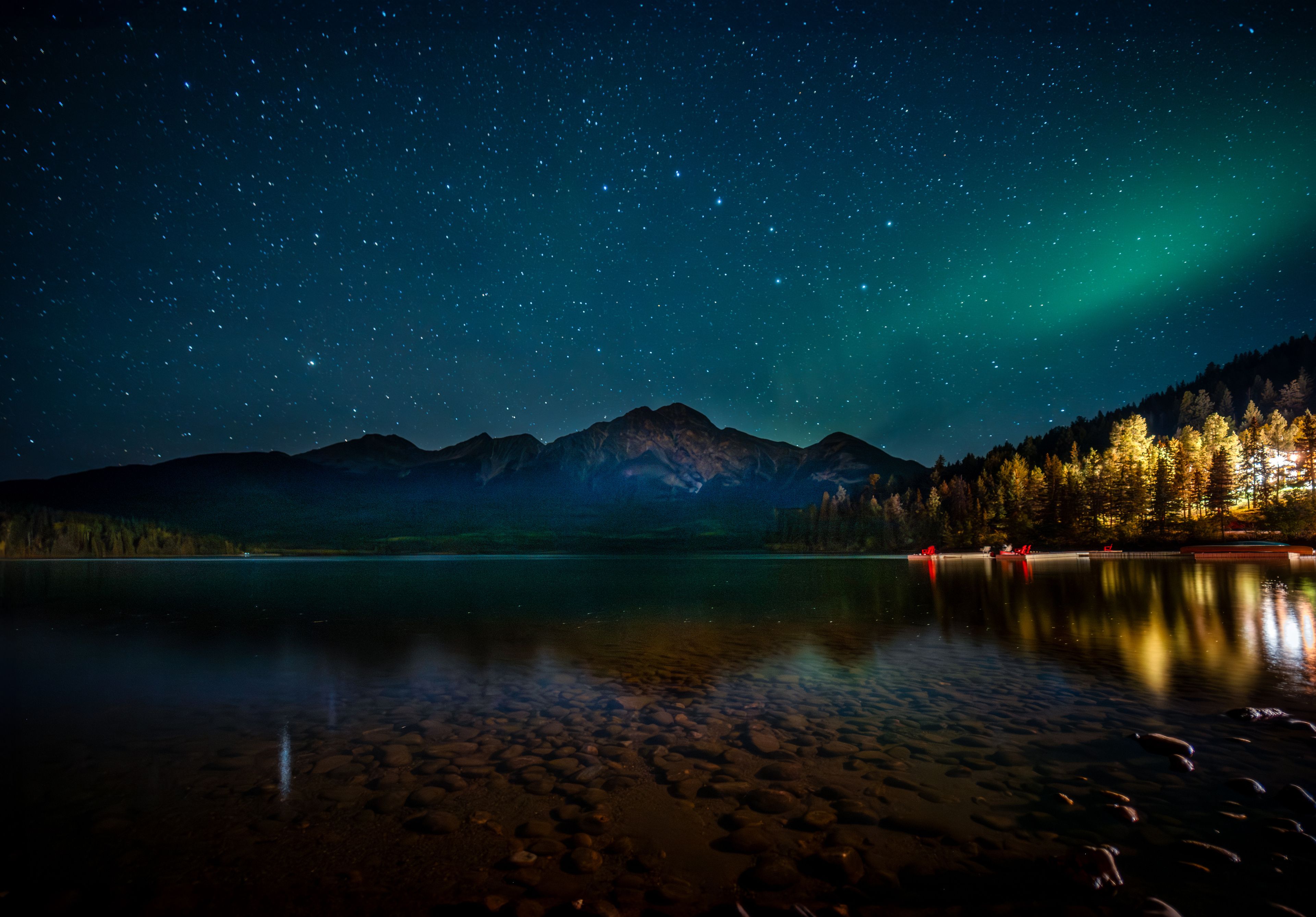 A starry sky with northern lights over Pyramid Lake.