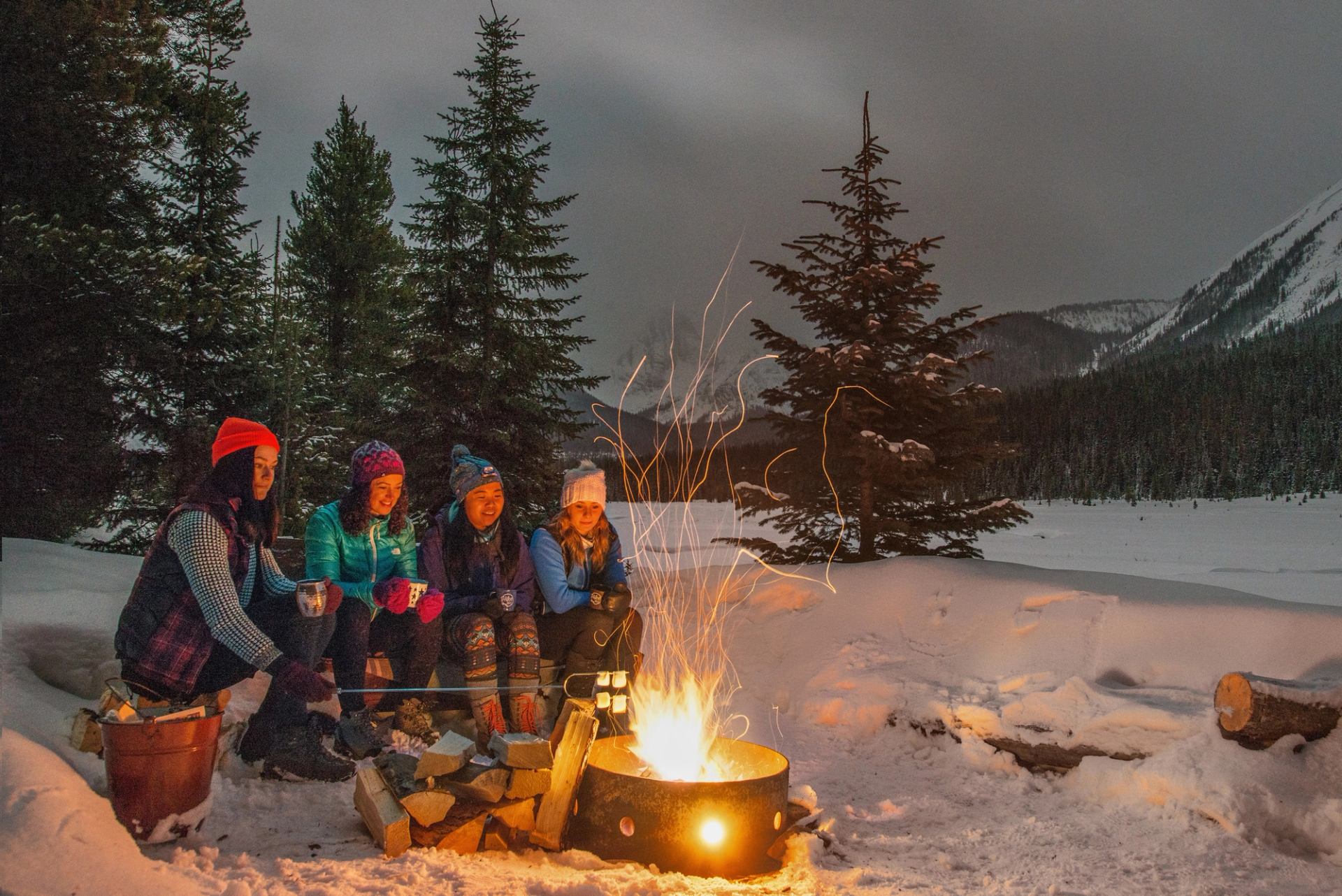 Friends socializing inside a yurt at Mt. Engadine Lodge in Kananaskis Country.