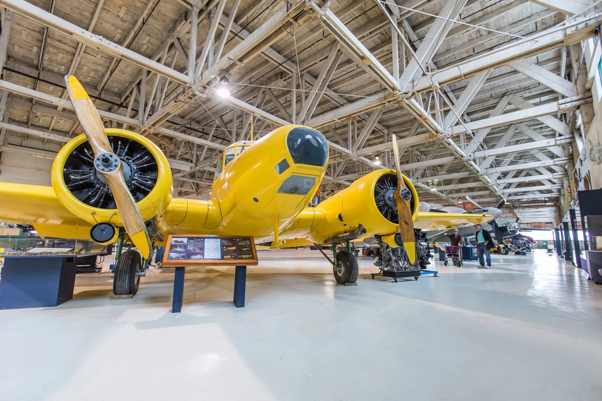 Family looking at airplanes in the hangar at the Alberta Aviation Museum in Edmonton.