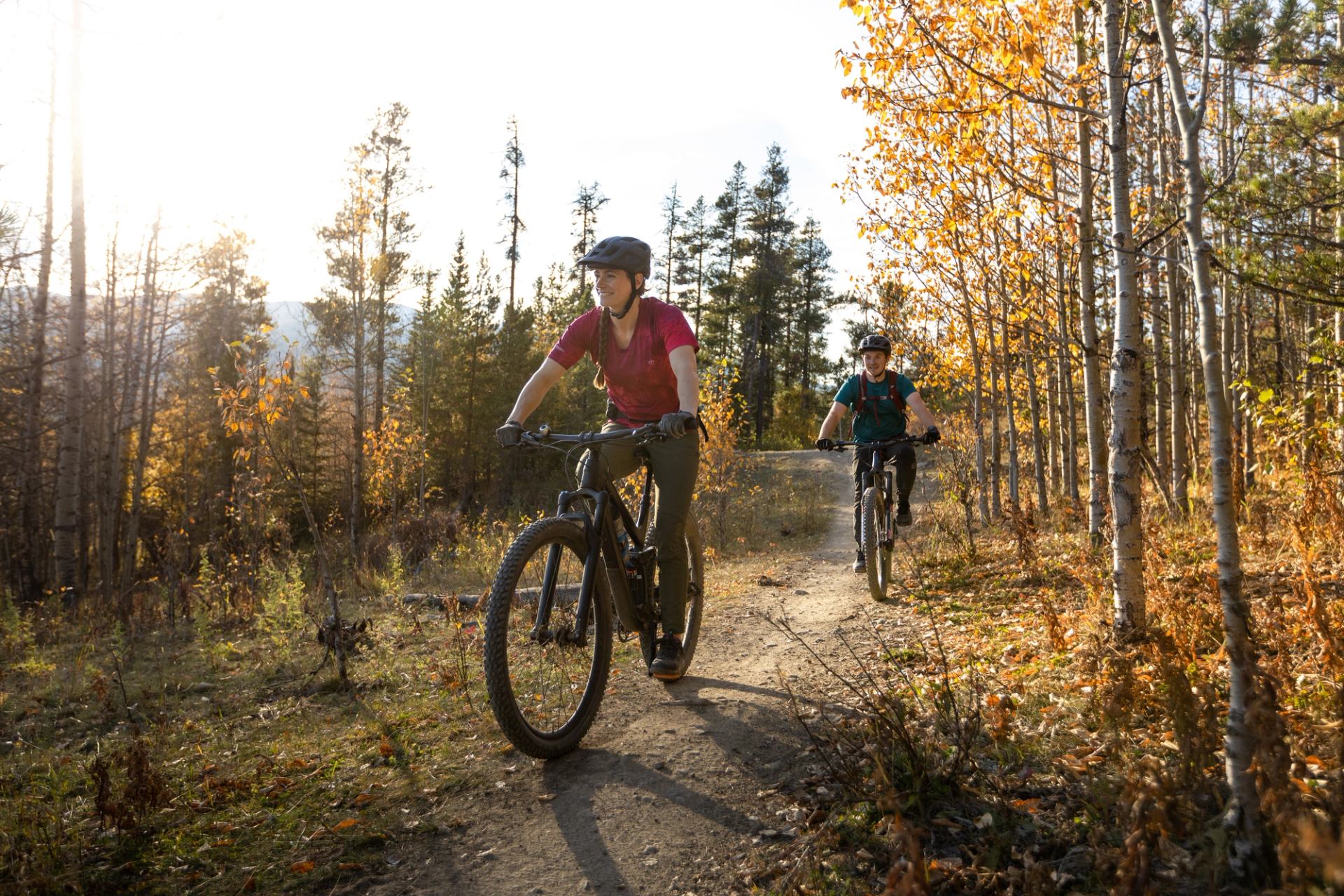 Cyclists biking the trails of Bragg Creek.