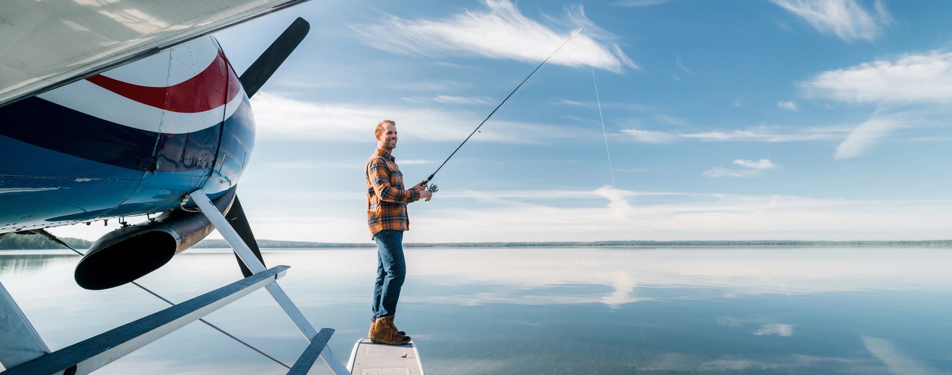 Man fishing off of float plane near Fort McMurray at Gypsy Lake Lodge.