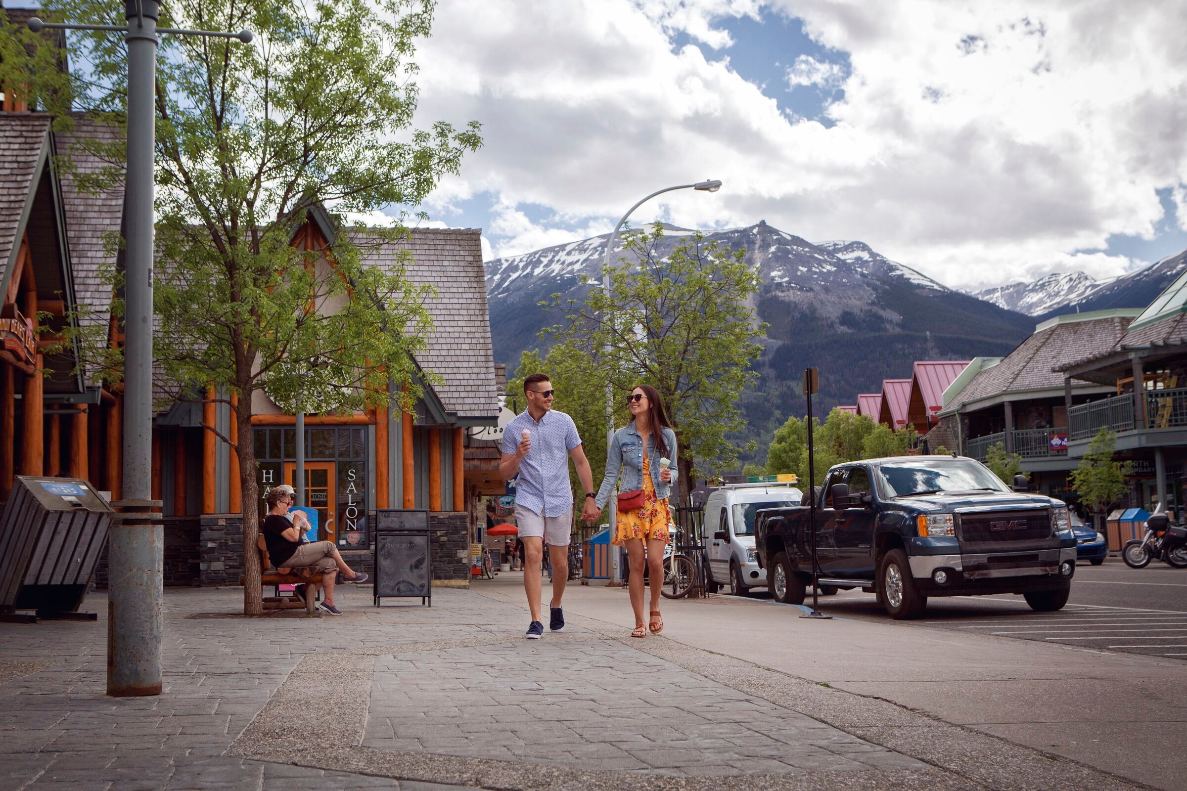 Couple walking and eating ice cream in downtown Jasper.