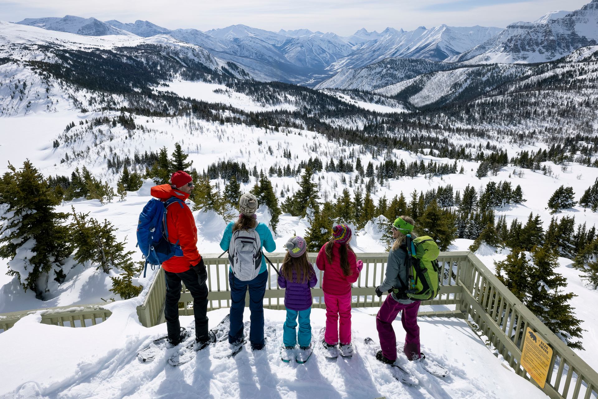 A family on a snowshoe tour to Sunshine Meadows in Banff National Park.