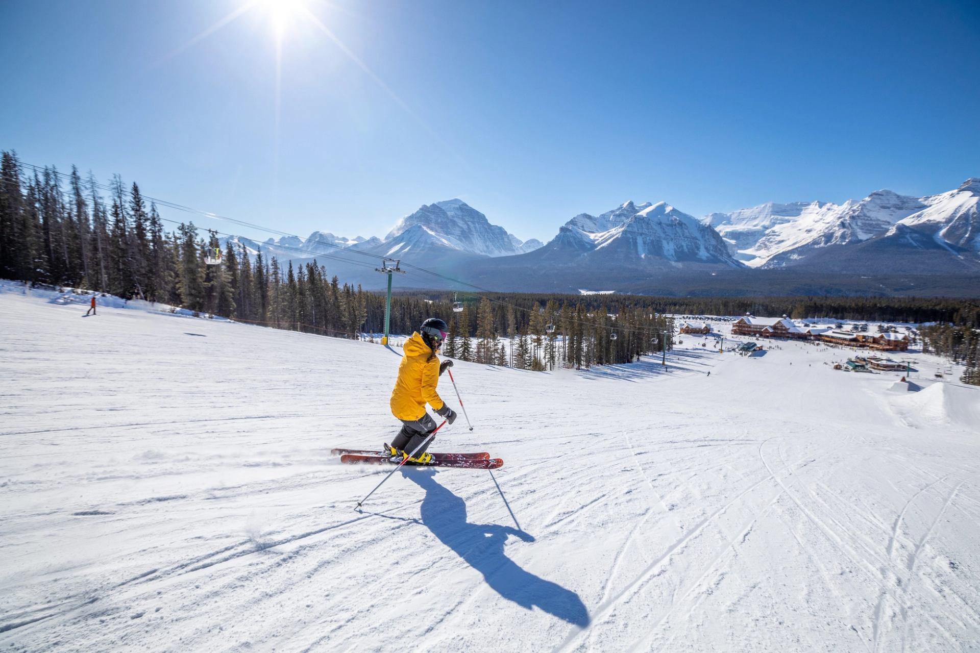 A skier skiing down an intermediate run at Lake Louise Ski Resort in Banff National Park