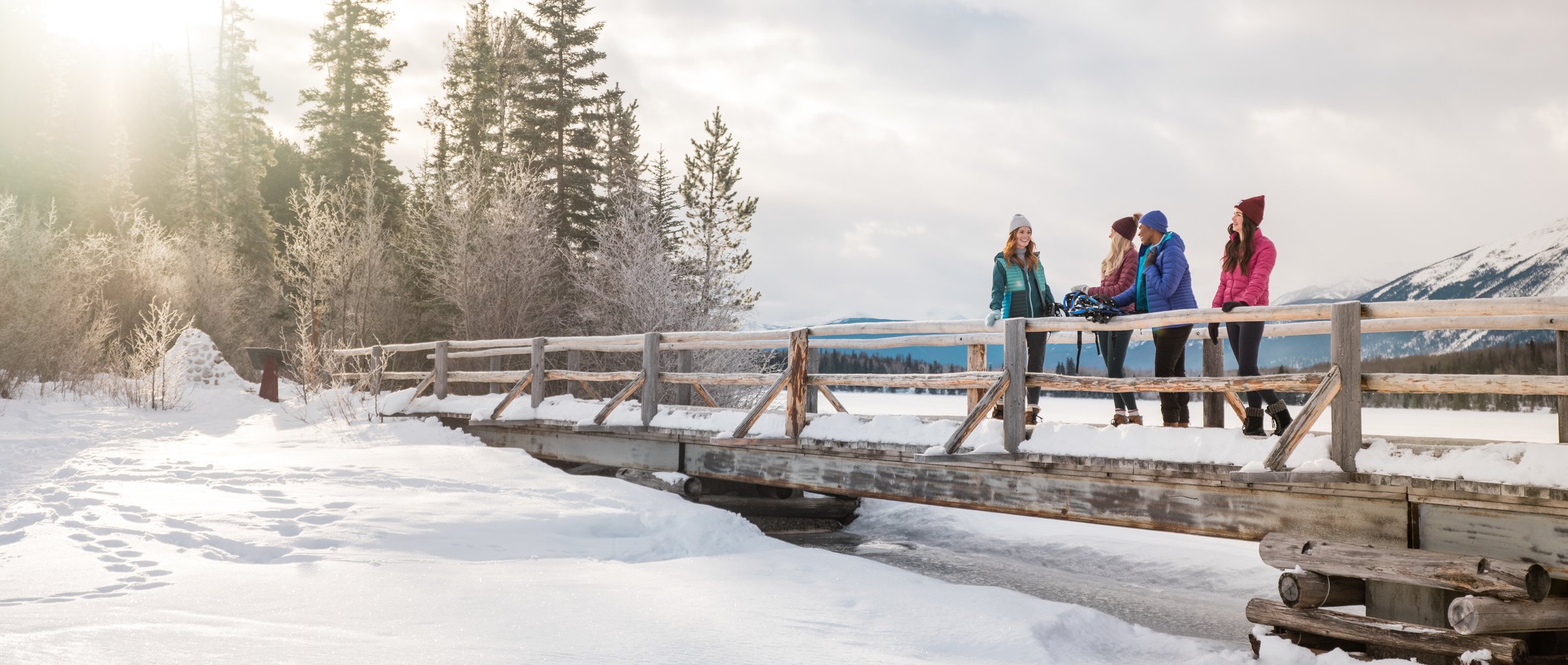 A group standing on the bridge at Pyramid Lake in winter.