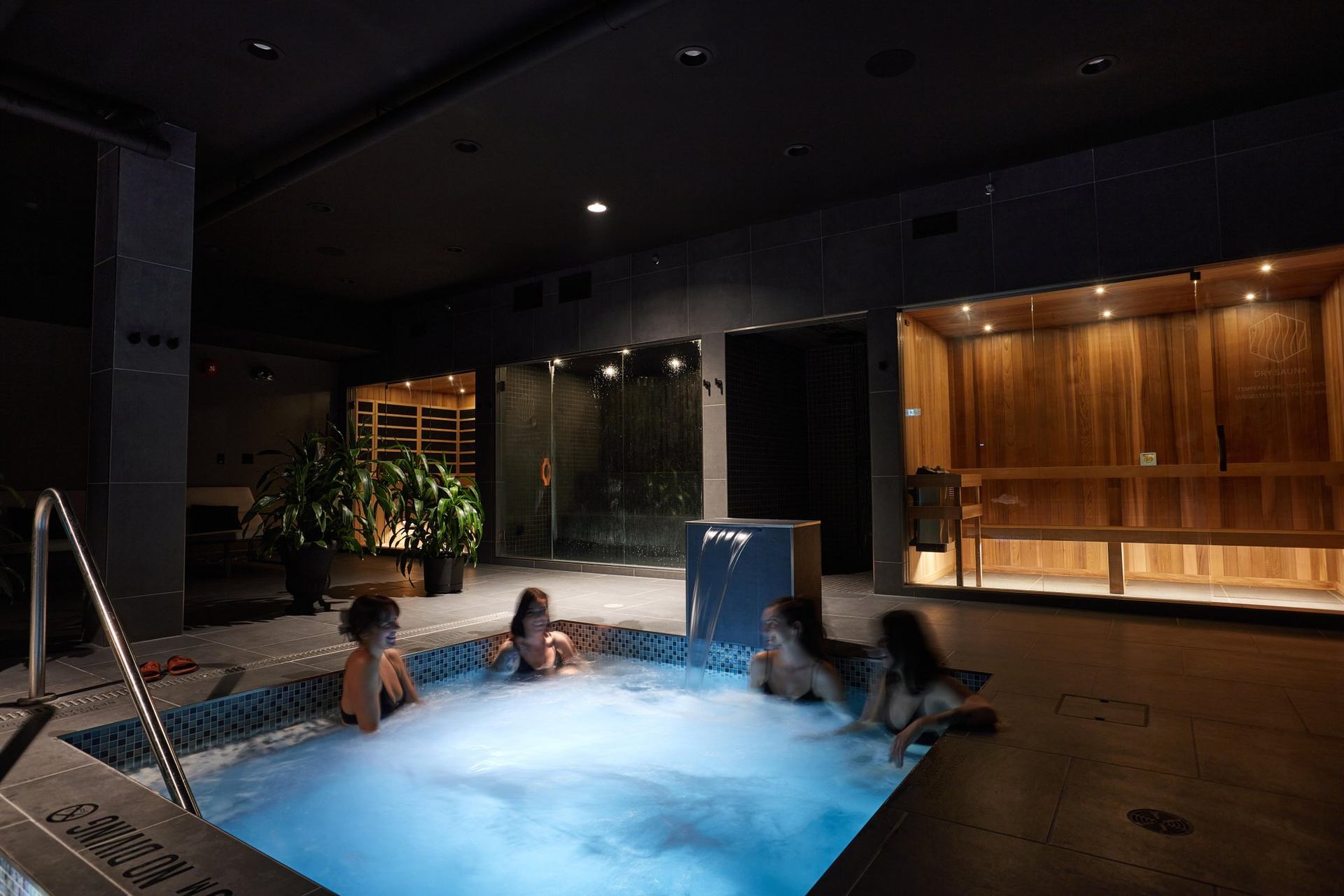 A group chats in a hot pool at Ska Thermal Spa in Calgary.