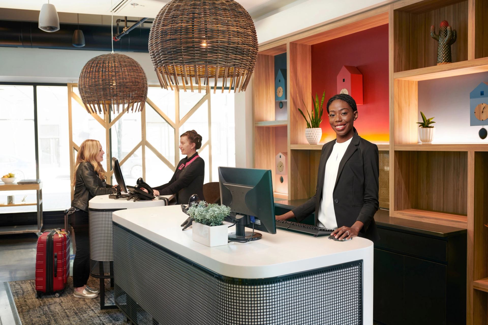 Guests are greeted at the reception desk at Alt Hotel in Calgary.