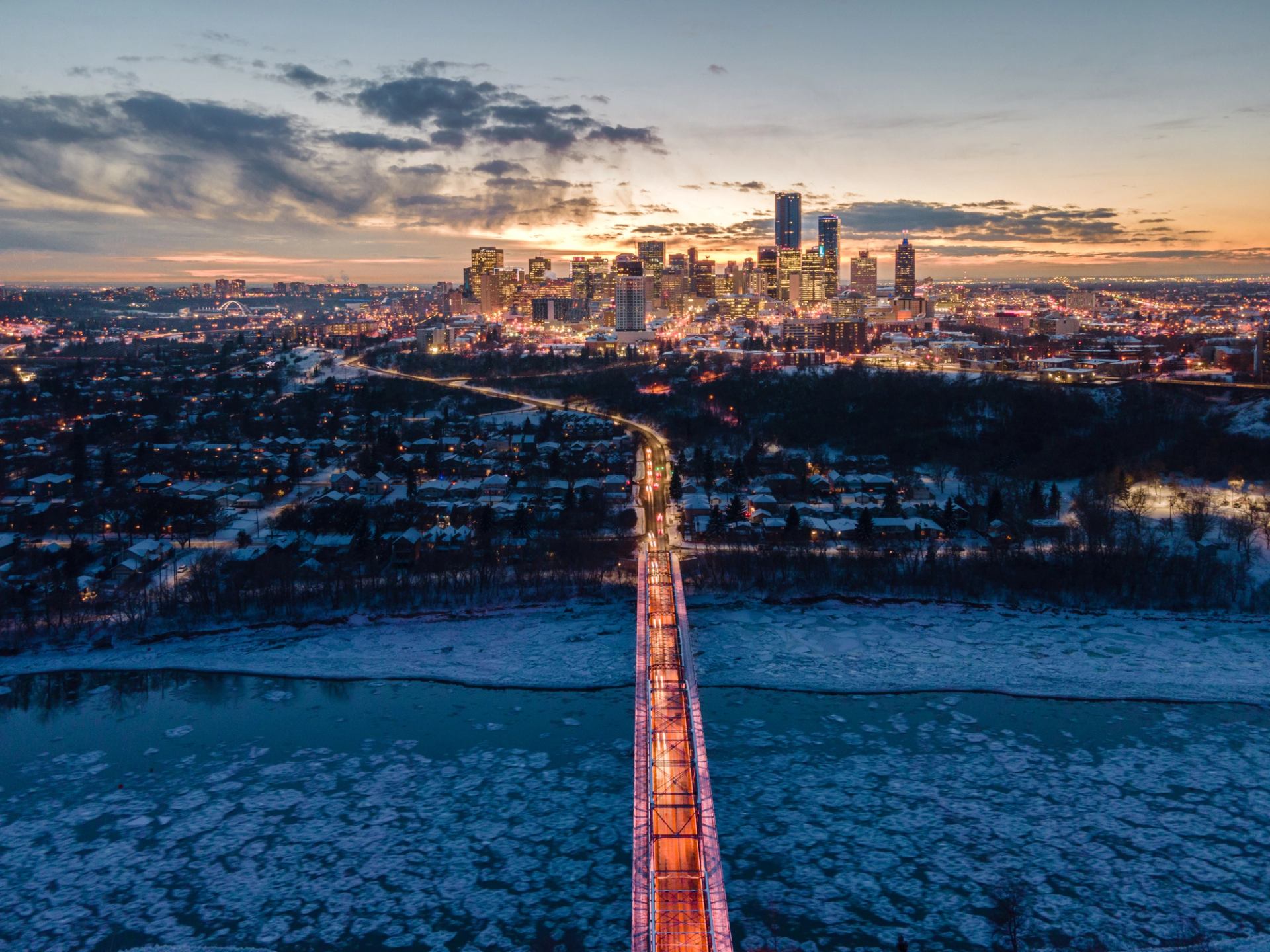 Wide shot of the city of Edmonton at sunset.