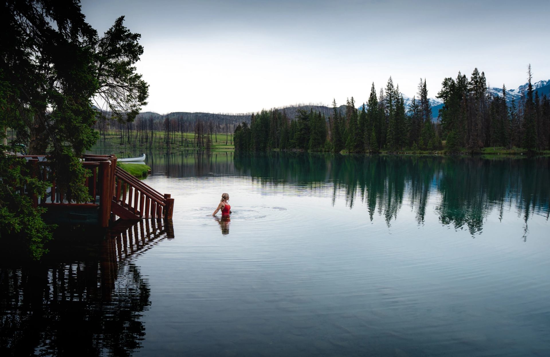 Guests enjoy a swim in the lake at Jasper Park Lodge.