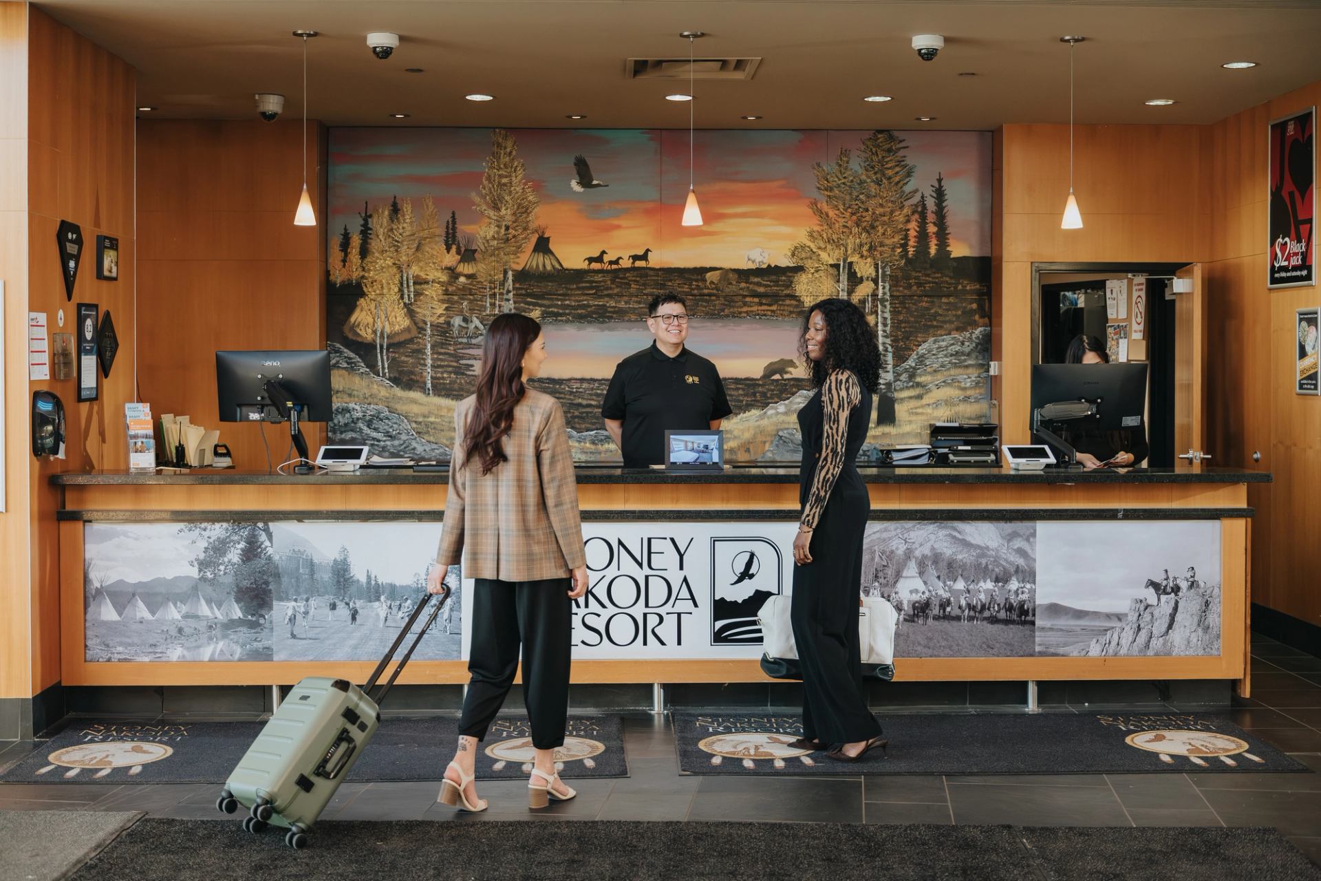 2 guests at reception at Stoney Nakoda Resort.