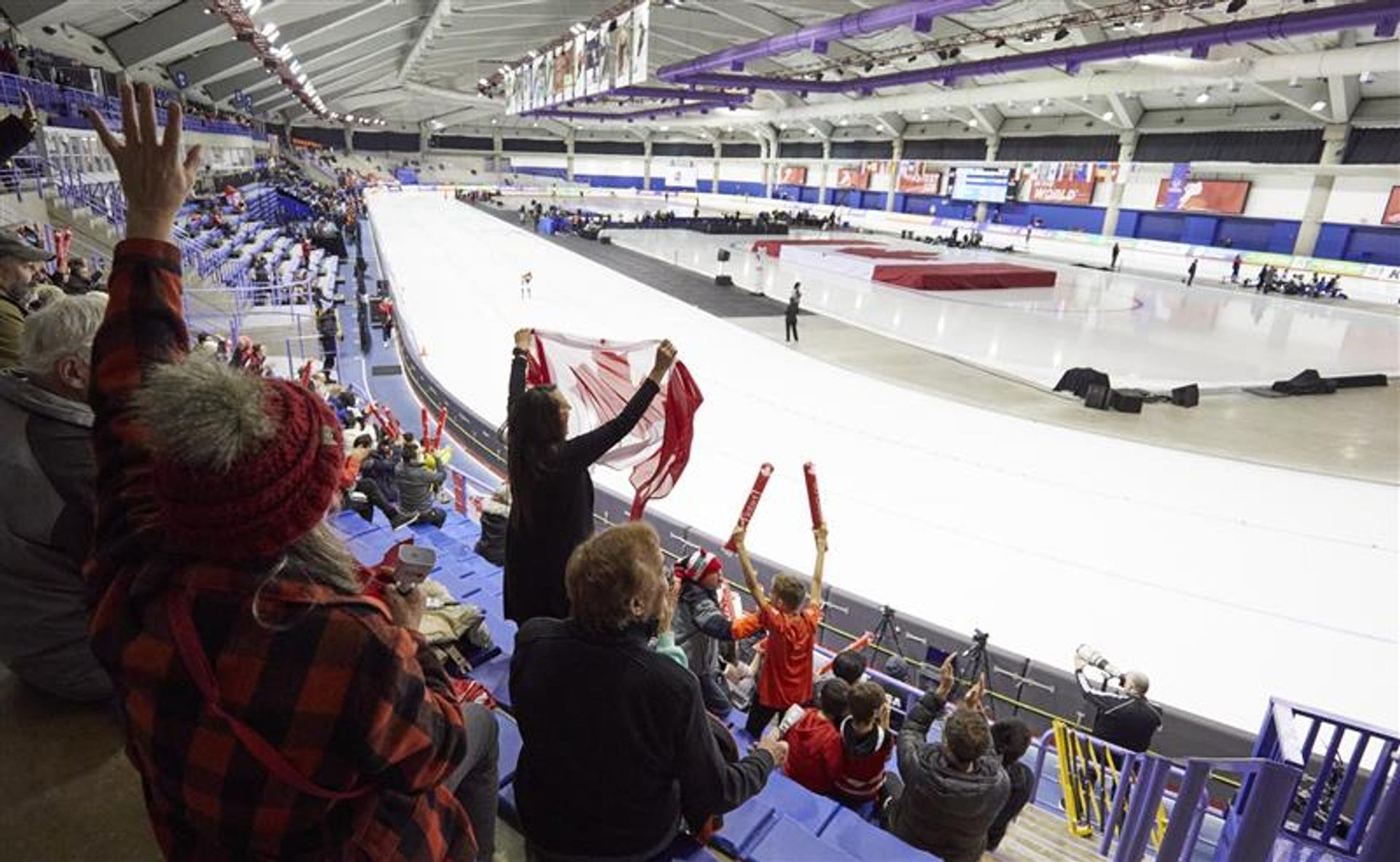 Fans cheering on athletes at the Olympic Oval in Calgary.
