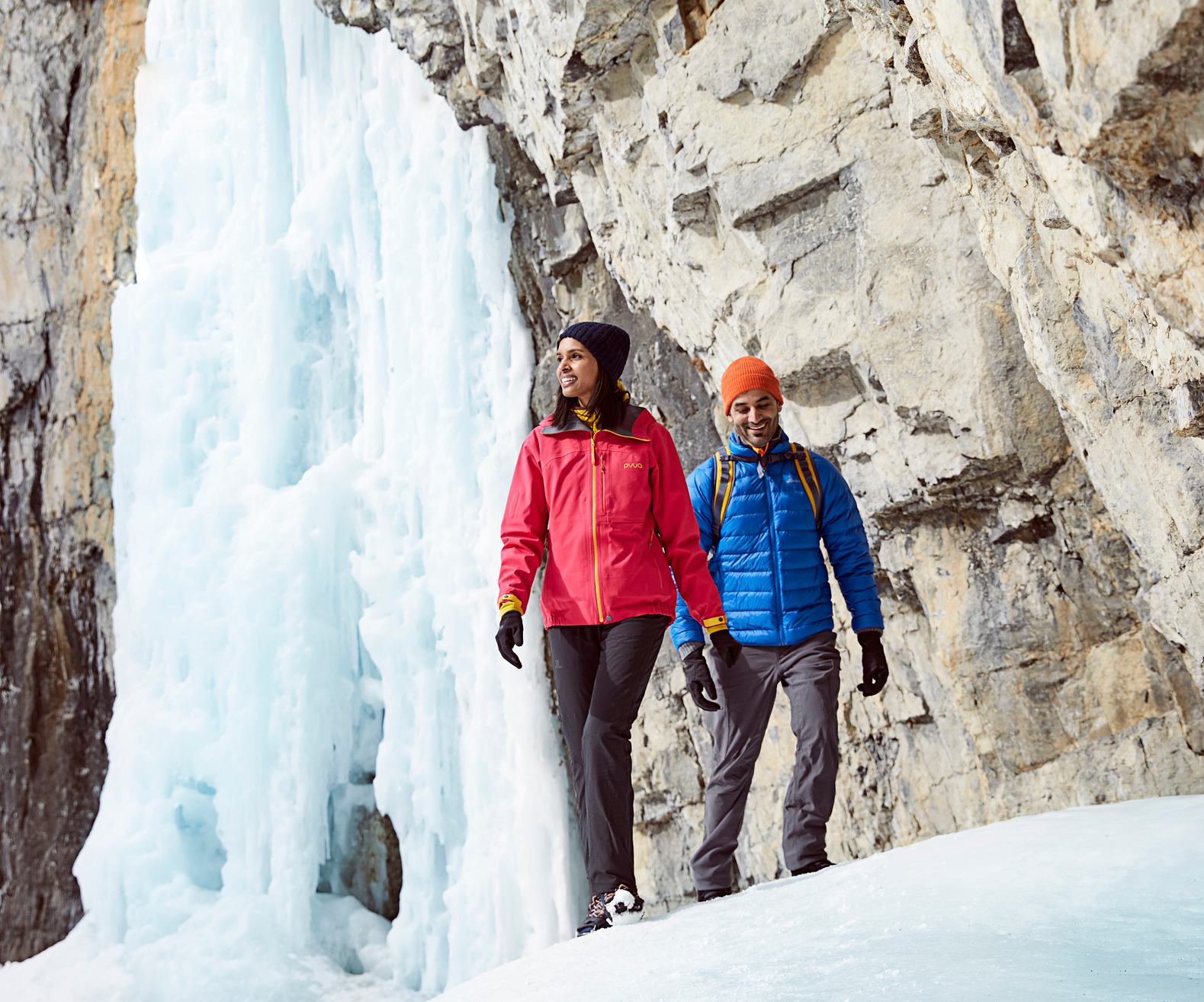 A couple ice hiking through Grotto Canyon near Canmore in Kananaskis Country.